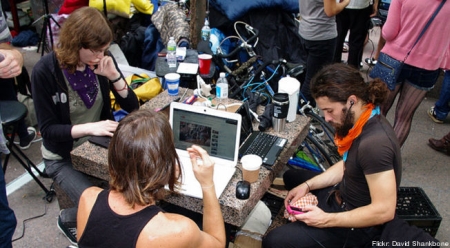 Occupiers with Computers and iPhones because of Capitalism