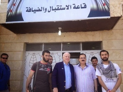 Senator John McCain cheeses it up with some terrorists